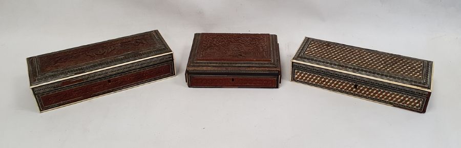 Three eastern style boxes all with parquetry inlay, one opening to reveal inlaid roundel to interior