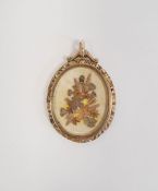9ct gold double glass locket, oval with scroll surmount, chased sides inset with small pressed