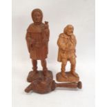 Carved wooden figure, Falconer, by Patrick Conoley of a man holding a falcon, dated 1969, 27cm high,