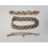 Silver bracelet of multiple interlocking links, another silver-coloured bracelet of oval and bar