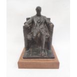 After Daniel Chester, French pottery reproduction of a seated Abraham Lincoln (with losses),
