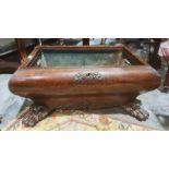 19th century mahogany wine cooler, sarcophagus shaped body on carved paw feet