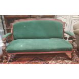 Victorian sofa mahogany frame, green upholstered seat back and armrests, turned and fluted front