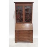 Late 19th/early 20th century mahogany satinwood-banded bureau bookcase, moulded cornice above two