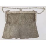 An early 20th century silver chain purse, with import marks, marked 925, foliate detail to clutch,