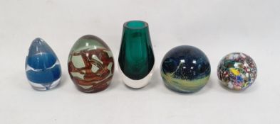 Mdina glass paperweight with cream and orange centre, three other glass paperweights and a green