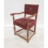 20th century oak armchair, turned and block supports, stretchered base, red ground upholstered