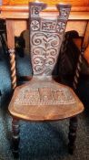 Late 19th century oak chair, the carved back dated 1875 with the initials F.D.C, the seat with