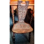 Late 19th century oak chair, the carved back dated 1875 with the initials F.D.C, the seat with