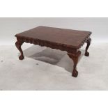 20th century figured wood coffee table of rectangular form, moulded wavy edges, on cabriole legs,