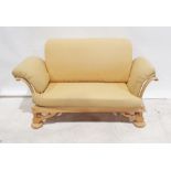 1960s/70s oak framed two seater sofa in pale yellow upholstery with adjustable scroll ends