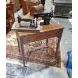 Singer sewing machine in table and one further sewing machine (2)