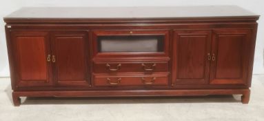 Modern Chinese hardwood lounge unit, rectangular top above assorted drawers and cupboard doors,