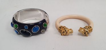 Blue ground and white metal bangle set simulated blue and green stones and a reproduction Cartier