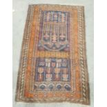 Eastern navy ground rug with hooked medallions, on a stepped border, 138cm x 88cm