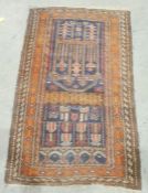 Eastern navy ground rug with hooked medallions, on a stepped border, 138cm x 88cm