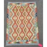 Chobi kilim rug with central field with lozenges within red borders, 148cm x 105cm