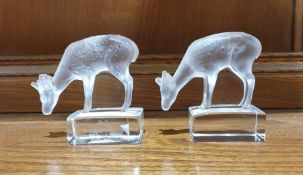 Two Lalique glass models of fawns, with frosted glass bodies, on rectangular clear glass bases,