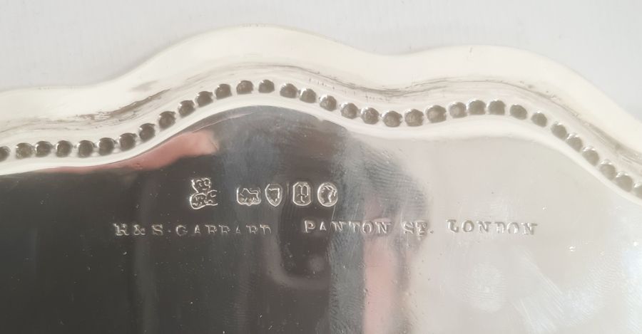Victorian silver salver with beaded rim, indistinct motto to centre, on claw and ball feet, London - Image 3 of 3