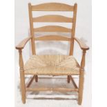 Low oak framed ladderback chair with rush seating