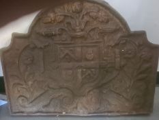 Cast iron fireback with armorial decoration