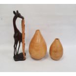 Two turned wooden vases and a hardwood model of a giraffe (3)