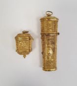 A 19th century gilt metal etui, tapering octagonal shaped, relief decorated with flowers and