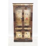 Pair of Chinese style cabinets with painted decoration, two closed doors above two single drawers,