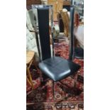 Set of four modern black leatherette and chrome effect dining chairs