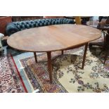 20th century McIntosh teak extending table on turned supports, 163cm x 74cm
