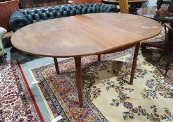 20th century McIntosh teak extending table on turned supports, 163cm x 74cm