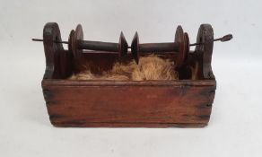 19th century winder fitted with two wooden spools over a pine base, 26cm long