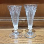 Two 18th century jelly glasses, both of wrythen design, with knopped stems and circular feet, 14cm