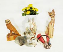 Carved model of an owl, a stylised carved model of a cat, a ceramic model of a dog, a modern