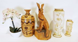 Carved wooden sculpture of a hare, a wooden vase, two porcelain vases with applied flower decoration