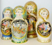 A group of four Russian nesting dolls, signed to base