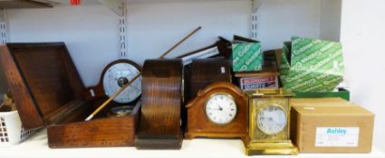 Three wooden mantel clocks, two modern barometers, a collection of electical junction boxes, etc