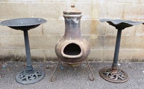 Mexican-style clay tone outdoor cheminea and two plastic birdbaths (3)