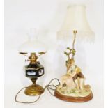 Capodimonte style table light of a male and female sitting under a tree, signed Vivien C, together