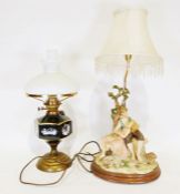 Capodimonte style table light of a male and female sitting under a tree, signed Vivien C, together