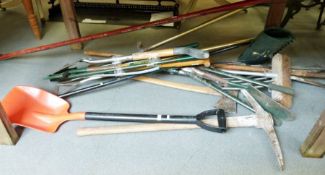 Collection of various garden tools to include rakes, forks, pitchfork, axe, spades, etc.