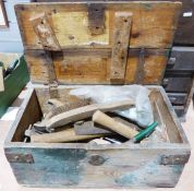 Wooden tool box containing various tools to include hammers, saws, etc.