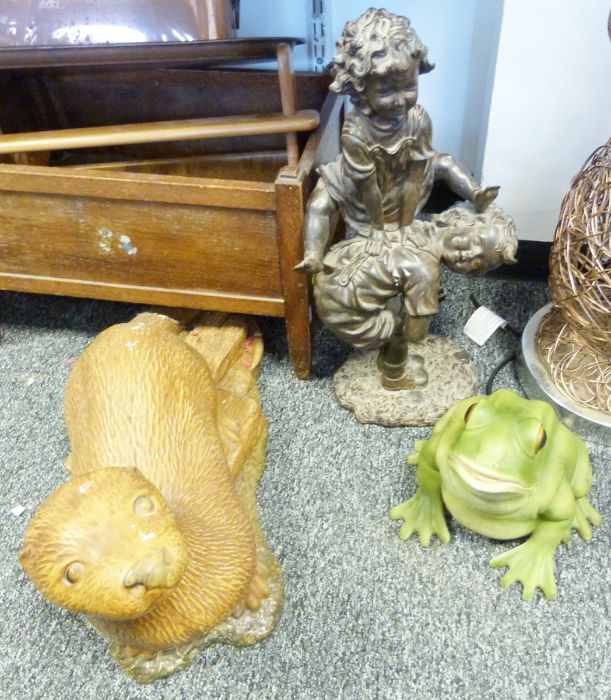 Stone model of an otter, a resin model of a frog, a bronzed resin sculpture of children