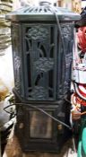 Green painted electric cast iron stove of octagonal form