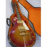 Columbus Les Paul-style electric guitar in red and orange, in fitted case Condition ReportAppears to