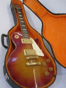 Columbus Les Paul-style electric guitar in red and orange, in fitted case Condition ReportAppears to