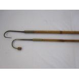 Two fishing gaffs with long brass and wooden handles, one stamped Hardy bros Makers, Alnwick, the