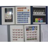 Two boxes with decimal mint stamps, face value £350 approx. in three albums and plastic bags, a