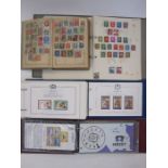 Box with two albums with envelopes with mostly commonwealth loose stamps on pieces, many