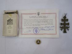 Metal crucifix with relief decoration and cherubs, with a boxed reliquary relic of S. Teresiae (